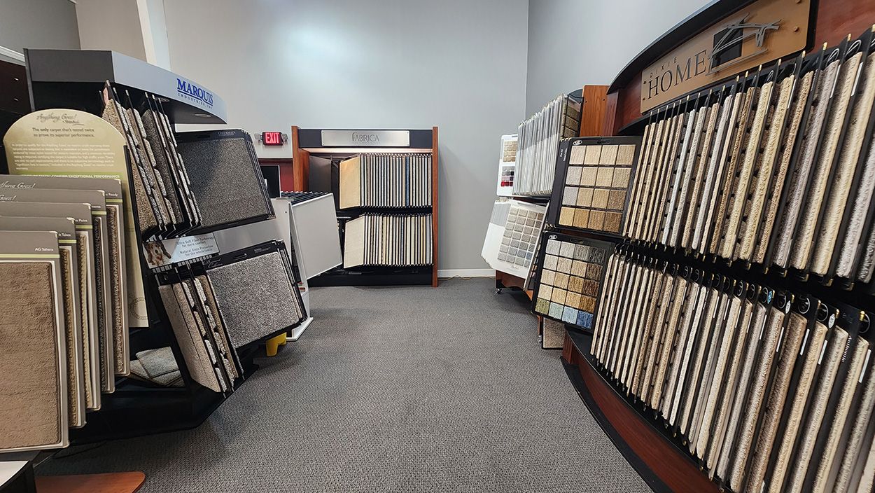 Shown here is our section of carpet product displays, featuring the brands Marquis, Dixie Home, and Fabrica in the back/center.
